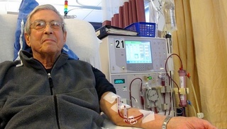 Man connected to hemodialysis machine