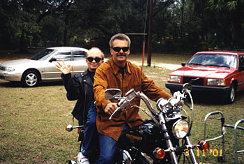 Bruce Schultz with friend on motorcycle